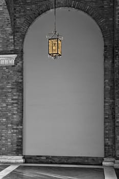 lantern under the arches of a convent