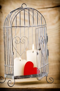 Candlestick cage style, candles, Valentine's Day decor.