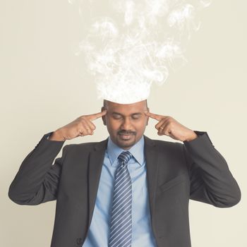 Businessman head burnout, smoke coming out from head.