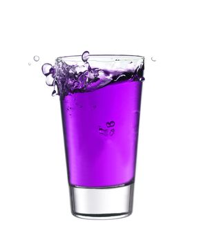 Splash in a glass of purple lemonade isolated on white background