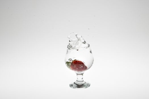 strawberry in the water splash on white background