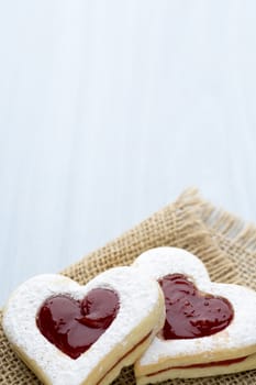 Cookies heart shape on the wooden ackground.