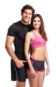 Sport couple - man and woman after fitness exercise on the white background