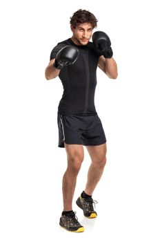 Athletic attractive man wearing boxing gloves on the white background