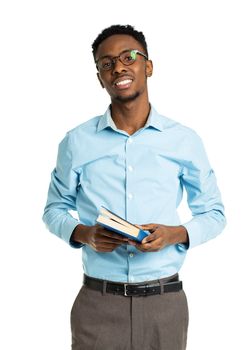 Happy african american college student with books in his hands standing on white background