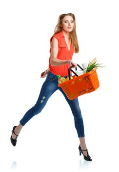 Young caucasian woman with assorted grocery products in shopping basket isolated on white background