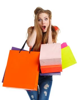 Happy caucasian woman holding shopping bags on white background is shocked. Holidays concept