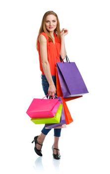 Happy caucasian woman holding shopping bags on white background. Holidays concept