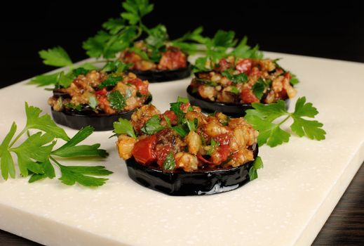 Appetizer of fried eggplant stuffed with vegetables, herbs