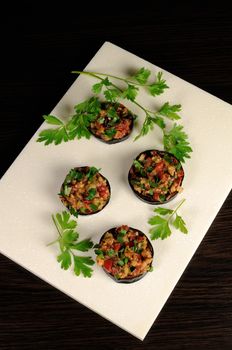Appetizer of fried eggplant stuffed with vegetables, herbs