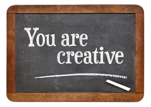 You are creative - positive affirmation words on a vintage slate blackboard