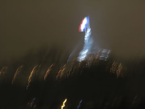 French political concept with flag and lights all blurry from camera shake.