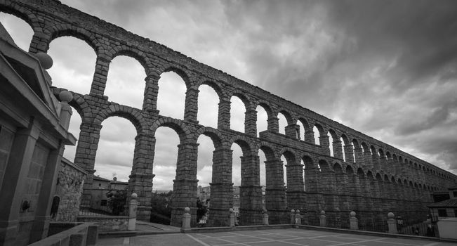 The ancient Roman aqueduct in black and white.