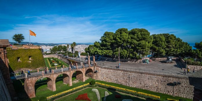 visiting a high castle in the main port of Barcelona, Spain.