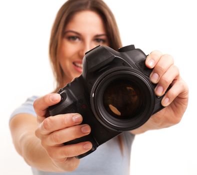 Young caucasian woman with professional camera in her hand