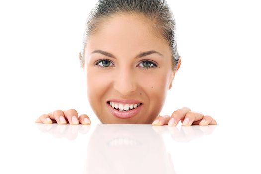 Portrait of a beautiful woman who is hiding and looks like she is playing over a white background