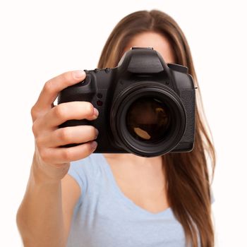 Young caucasian woman with professional camera in her hand