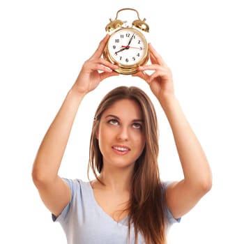 Young caucasian woman with alarm clock in her hands isolated over white background