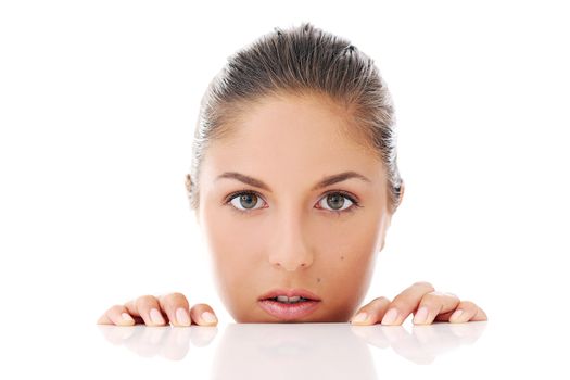 Portrait of a beautiful woman who is hiding and looks like she is playing over a white background