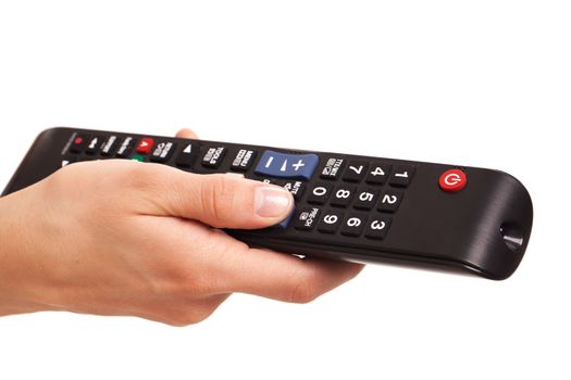 TV console in woman's hand isolated over white background