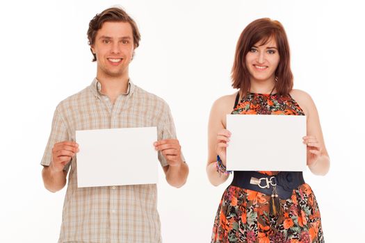 Caucasian couple with blank papers in their hands over white background