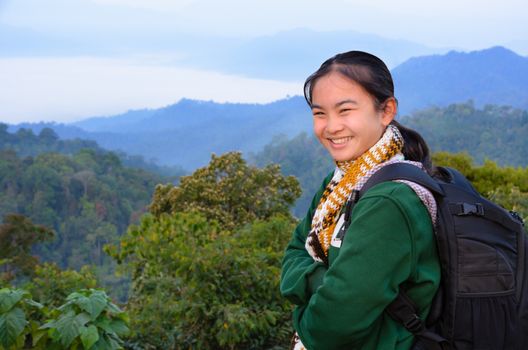 Tourist girl on the mountain in the morning at Panoen Thung scenic point Kaeng Krachan National Park Phetchaburi province Thailand