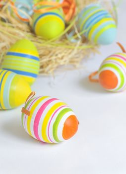 Easter eggs in nest and white background