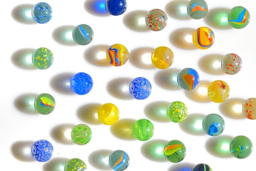 Colorful different Marbles on white background