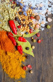 Herbs and spices on old table wood