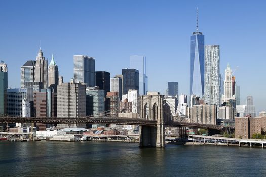 The New York City skyline at afternoon w the Freedom tower and Brooklyn bridge