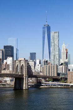 The New York City skyline at afternoon w the Freedom tower and Brooklyn bridge