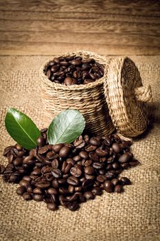 pile of coffee beans and wooden spoon in jar with space for text