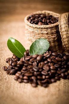 pile of coffee beans and wooden spoon in jar with space for text