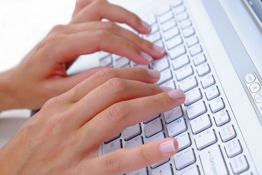 Keyboard Typing.female texting on a white laptop keyboard