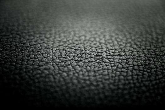 Black leather texture detail with shallow depth of field