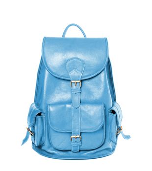 Sky blue leather backpack standing isolated on white background