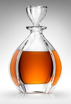 Carafe with whiskey on a gray background