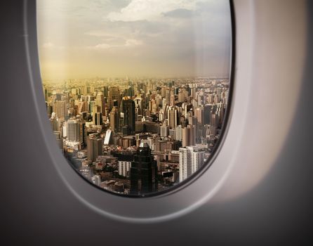 beautiful city view of Bangkok with blue sky from plane window