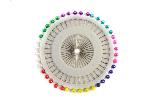 Sewing pin needles in their case on an isolated white background