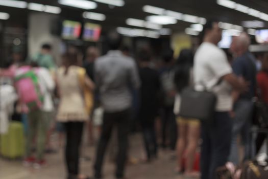 Abstract blur background of business crowd or people waiting queue for transportation or taxi at meeting point, shallow depth of focus