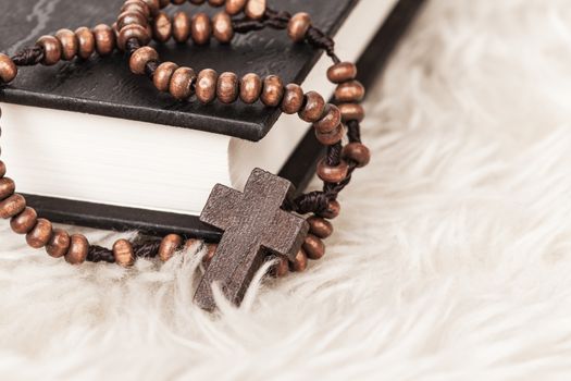 Christian cross necklace on Holy Bible book, Jesus religion concept as good friday or easter festival