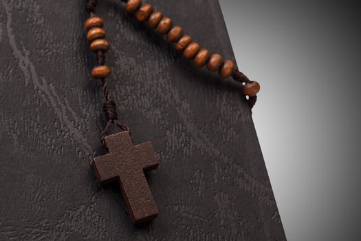 Christian cross necklace on Holy Bible book, Jesus religion concept as good friday or easter festival