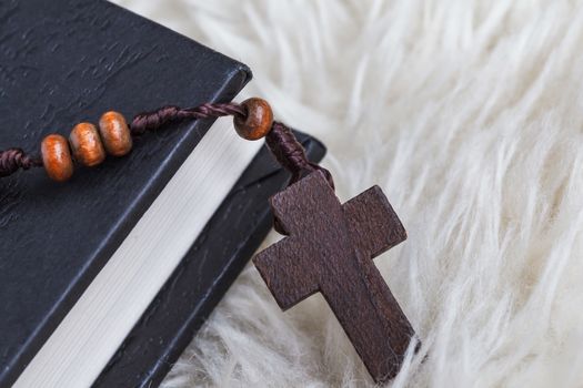 Christian cross necklace on Holy Bible book, Jesus religion concept as good friday or easter festival