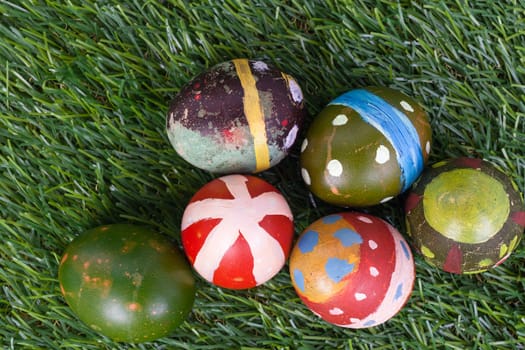 Happy easter eggs group on grass,can use as background for god festival, top view