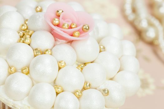 Wedding cupcake with sugar pearls