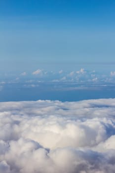 Soft clouds over view from airplane flying