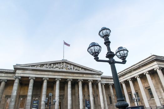 LONDON, UK - JANUARY 17: Lamp post with entrance to the British Museum in the background. January 17, 2015 in London.