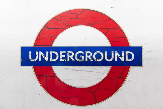 LONDON, UK - London JANUARY 31: Details of run down logo of the London Underground, with paint cracking and peeling off. January 31, 2015 in London.