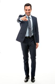 Full length portrait of a businessman smiling and pointing finger while walking