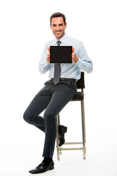 Full length portrait of a sitted businessman with digital tablet 